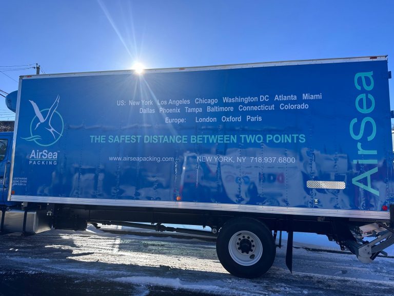 AirSea Packing box truck side with full vinyl wrap and city list lettering by Vinyl Images NY
