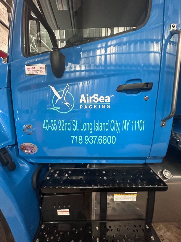 AirSea Packing truck cab door with vinyl logo, address and DOT lettering by Vinyl Images NY