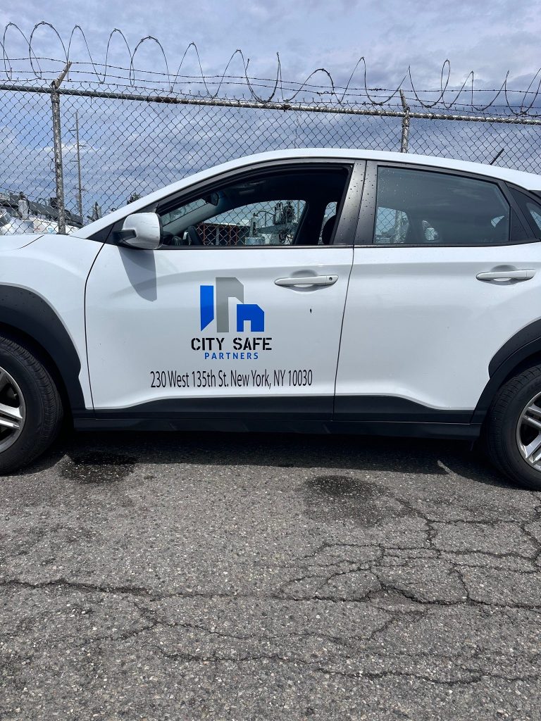 City Safe Partners logo and address vinyl lettering on a white Hyundai Kona door by Vinyl Images NY