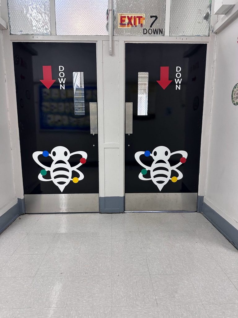 I.S. 162 Willoughby School stairwell doors with bee logo and down-arrow vinyl graphics by Vinyl Images NY