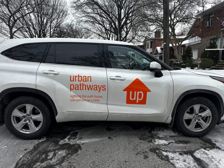 Urban Pathways logo vinyl door graphics on a white SUV by Vinyl Images NY